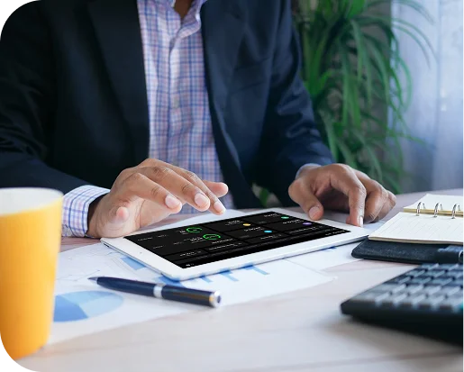 Trader monitoring a live performance dashboard on a tablet