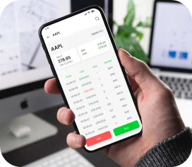 Trader holding a smartphone with real-time stock analytics.